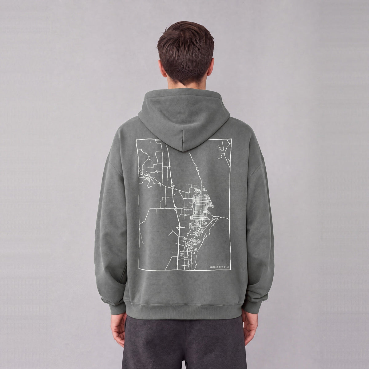 Brigham City map hoodie, back print on model - Gray