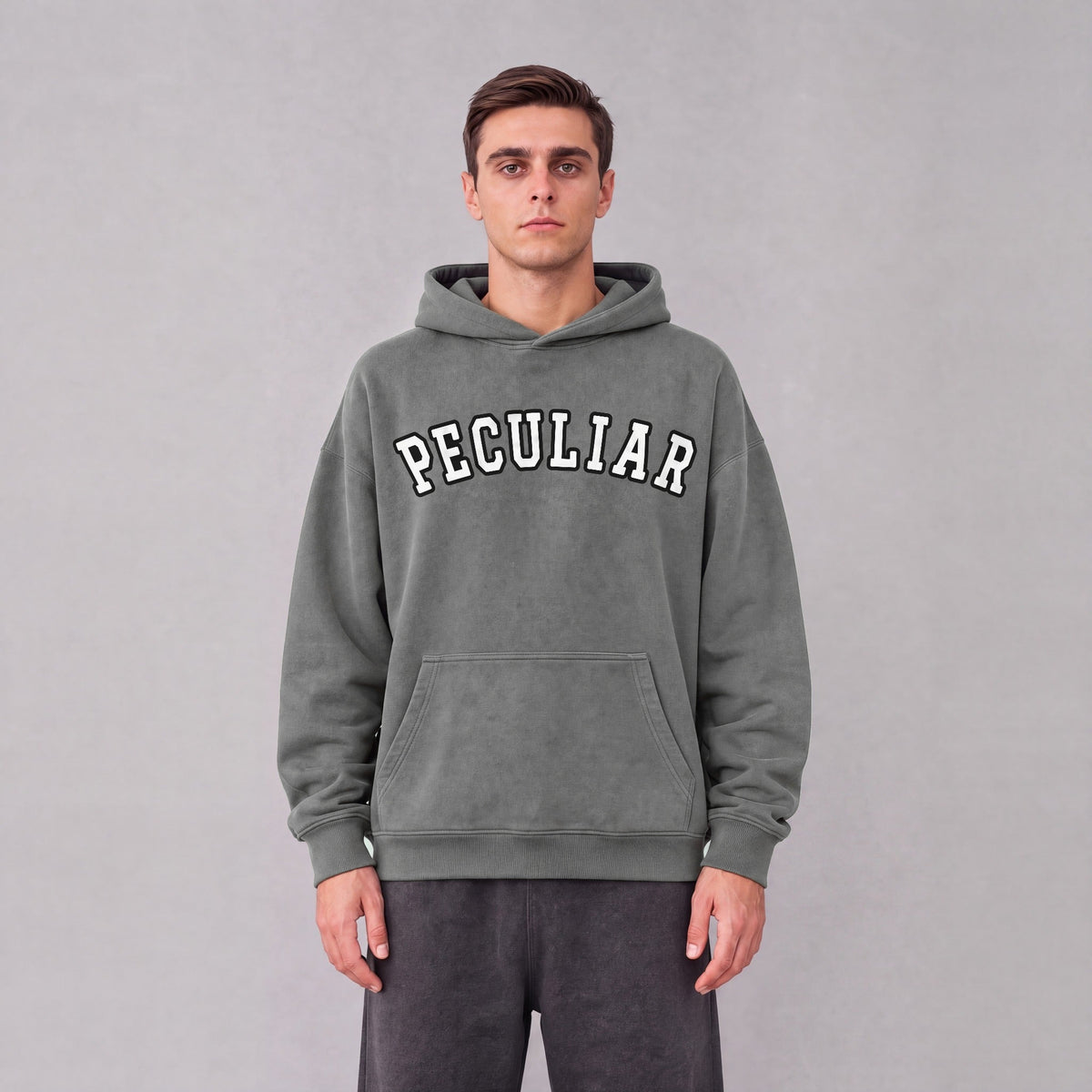 "Peculiar" collegiate hoodie front print on model - Gray