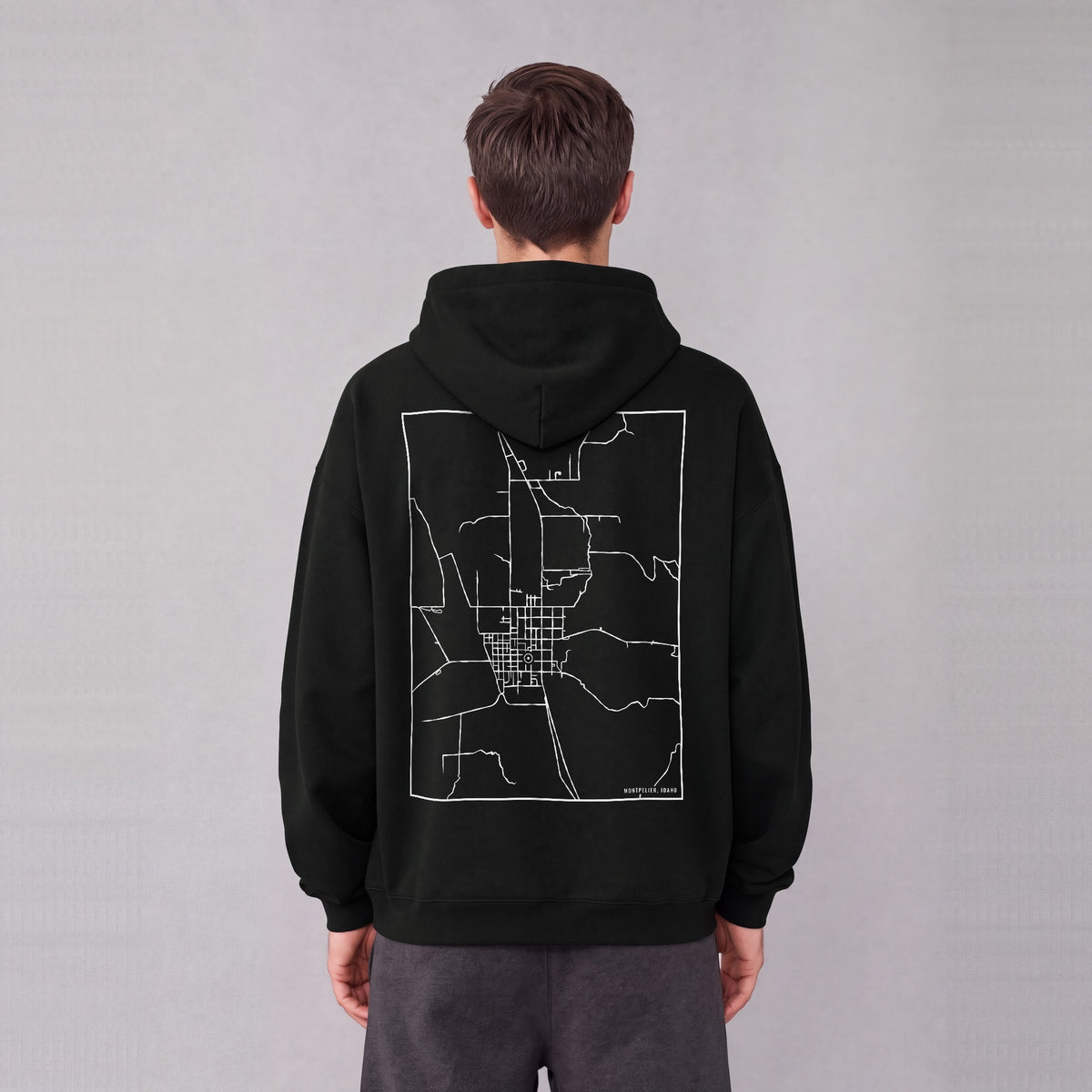 Montpelier map hoodie, back print on model - Black