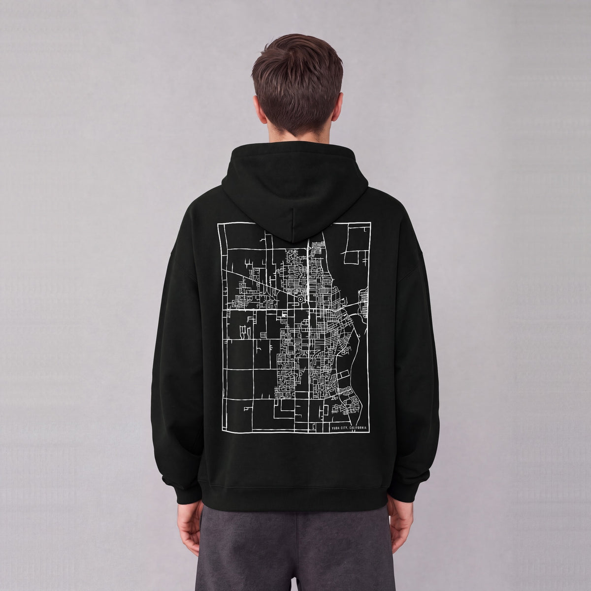 Yuba City map hoodie, back print on model - Black