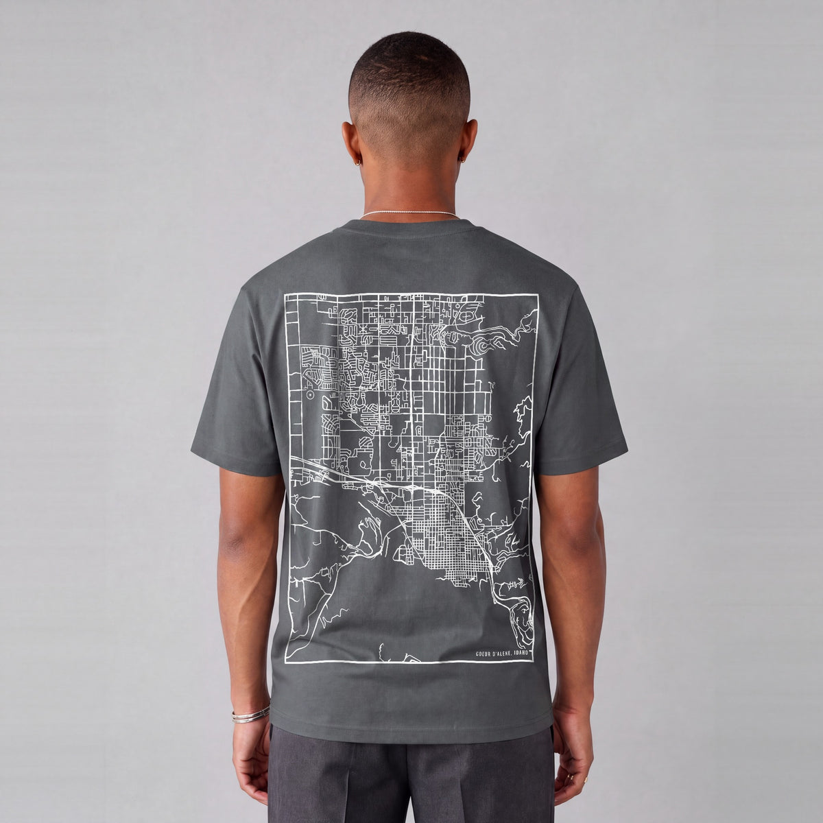 Coeur d'Alene map tee, back print on model - Charcoal