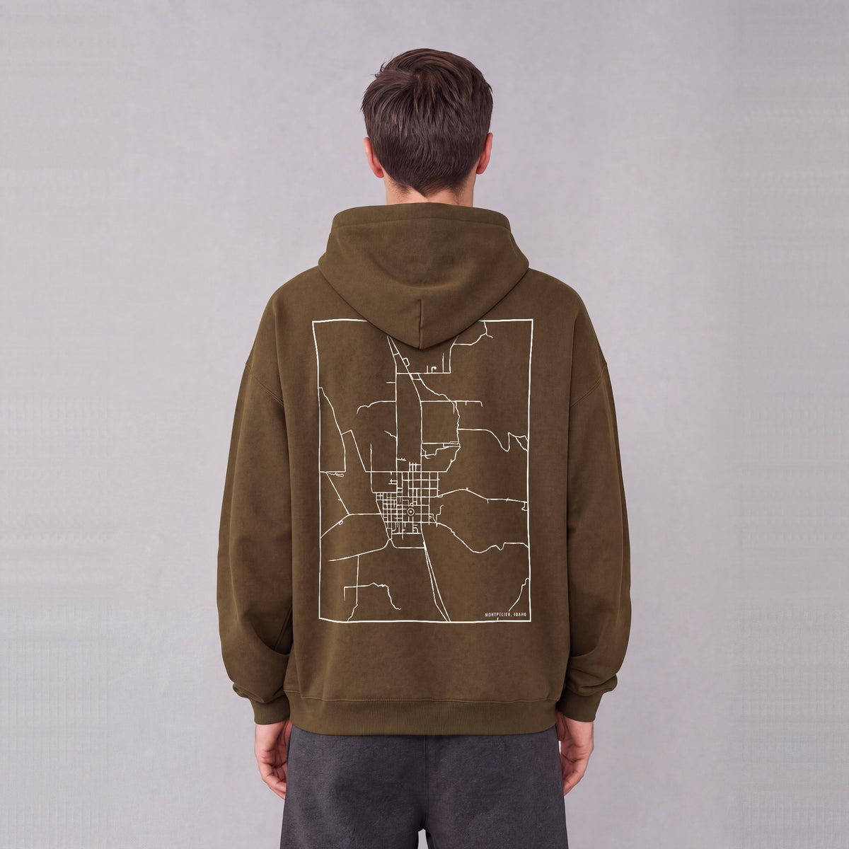 Montpelier map hoodie, back print on model - Coffee
