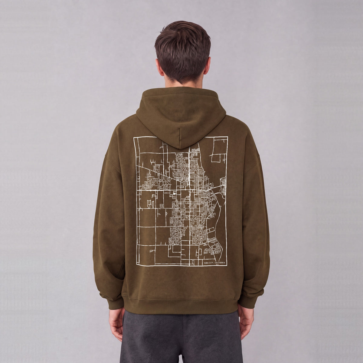 Yuba City map hoodie, back print on model - Coffee