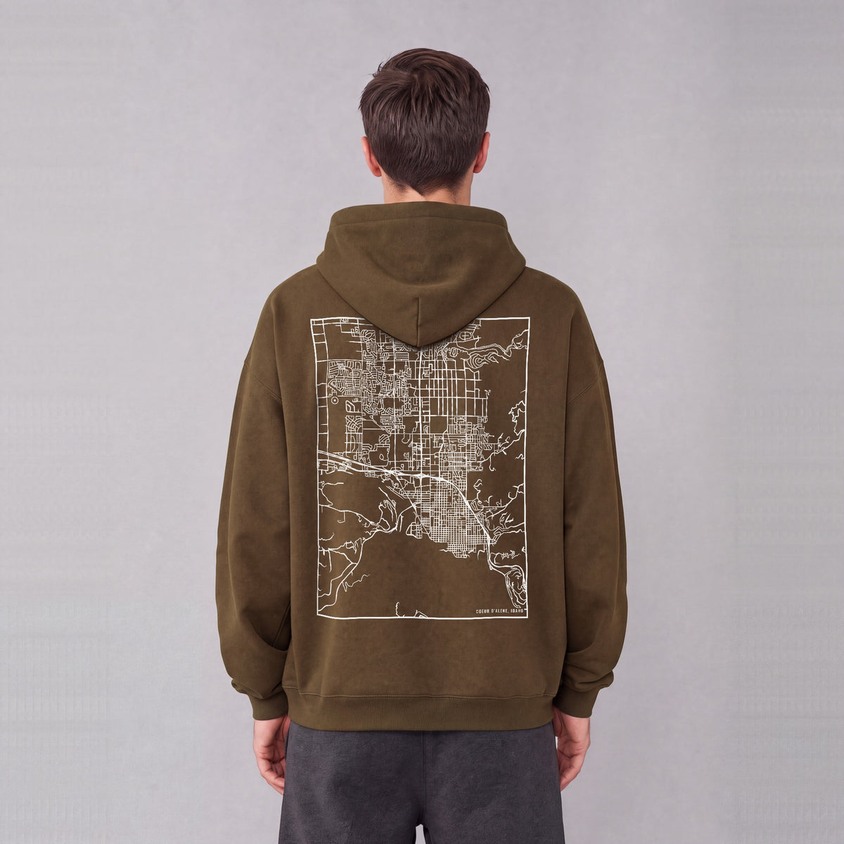 Coeur d'Alene map hoodie, back print on model - Coffee