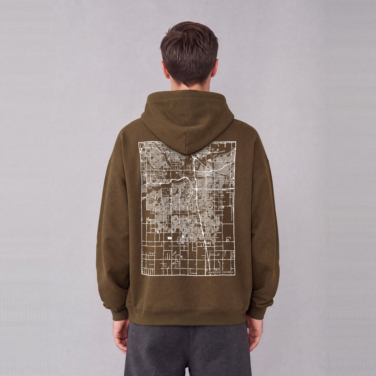 Bakersfield map hoodie, back print on model - Coffee