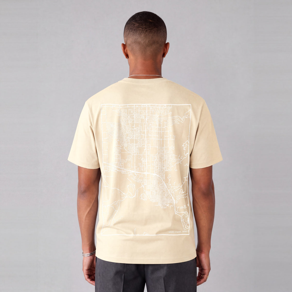 Coeur d'Alene map tee, back print on model - Cream