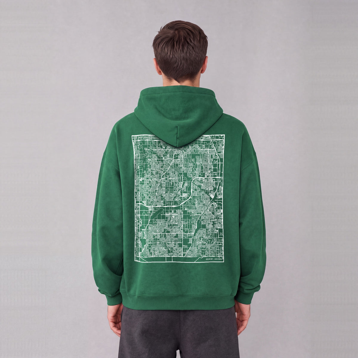 Gilbert map hoodie, back print on model - Eden Green