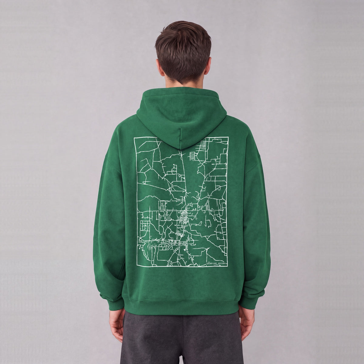 Snowflake map hoodie, back print on model - Eden Green
