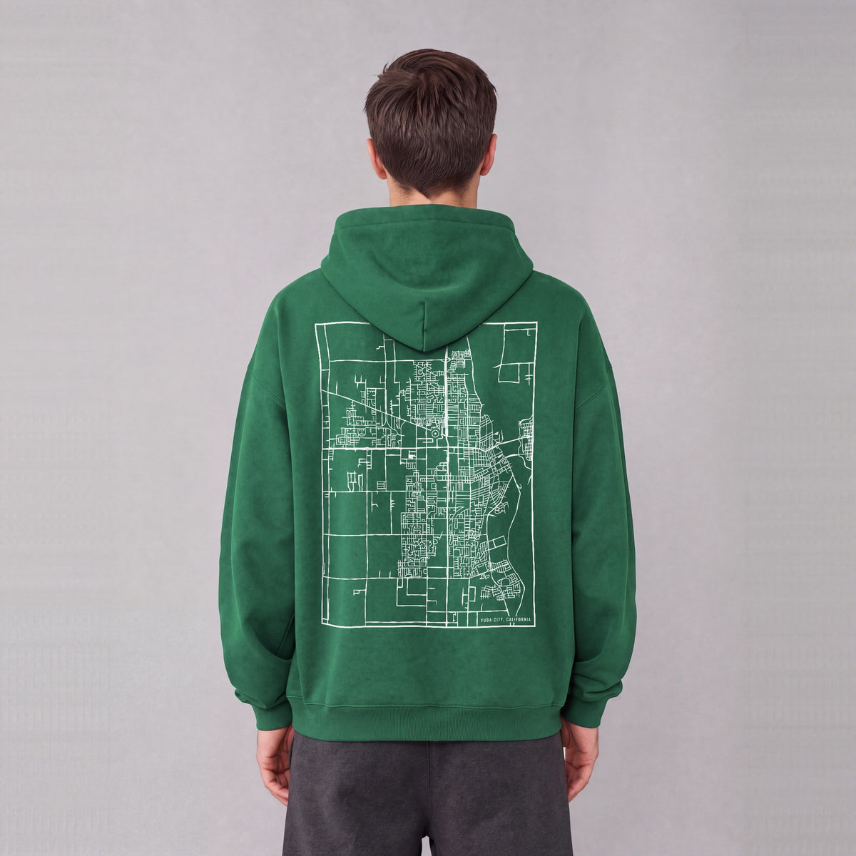 Yuba City map hoodie, back print on model - Eden Green
