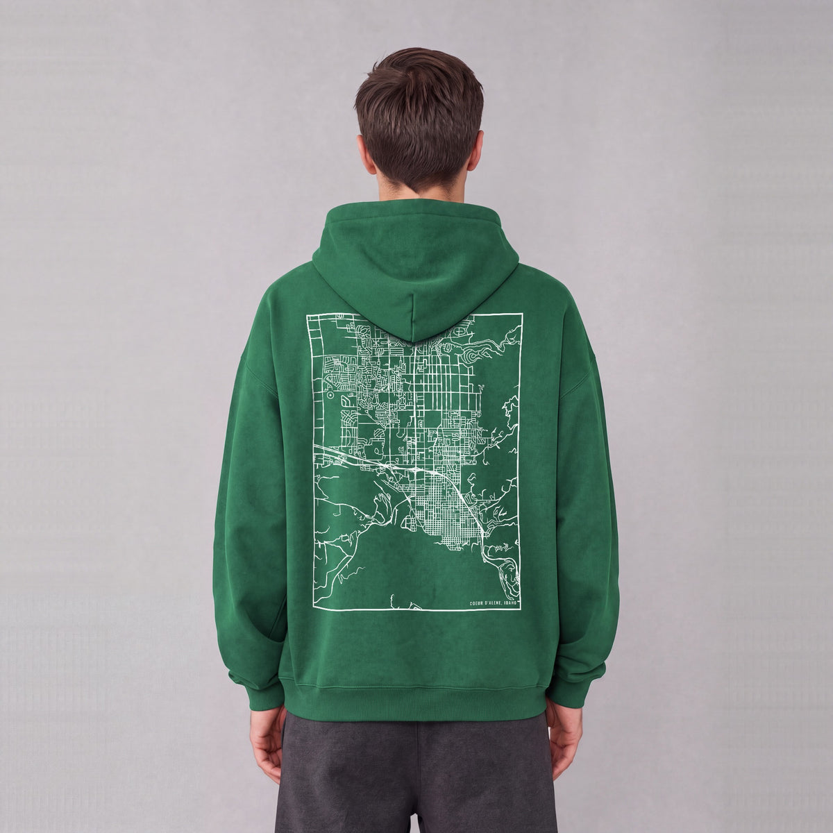 Coeur d'Alene map hoodie, back print on model - Eden Green