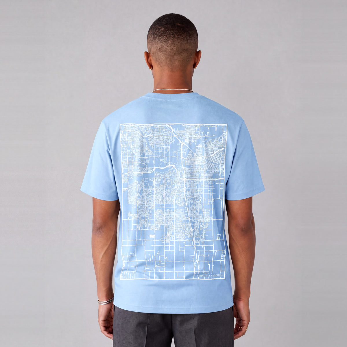 Bakersfield map tee, back print on model - Light Blue