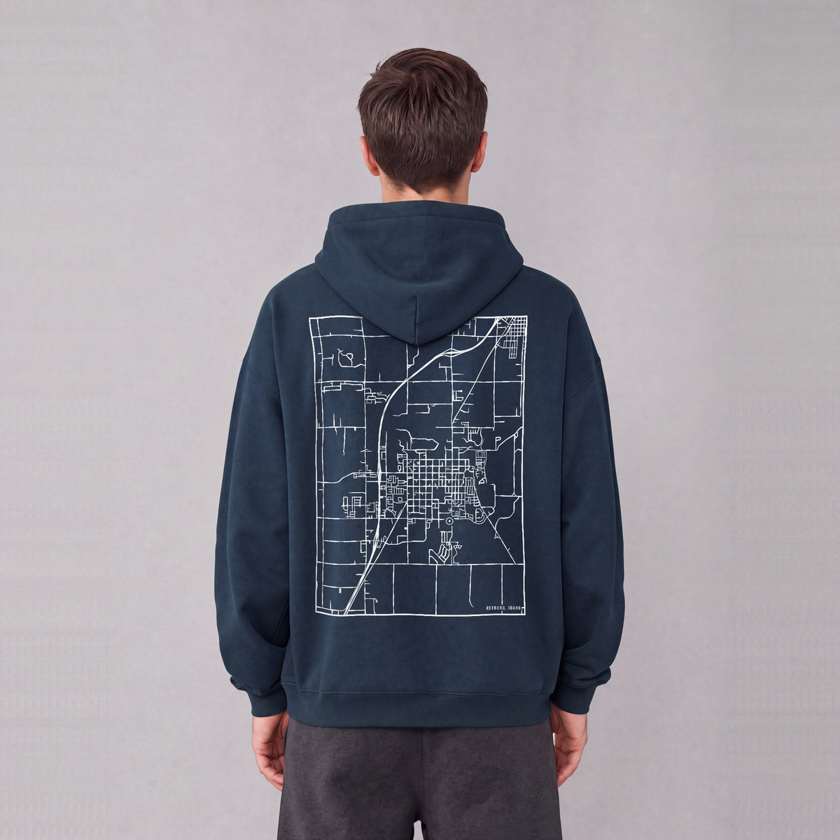 Rexburg map hoodie, back print on model - Navy Blue