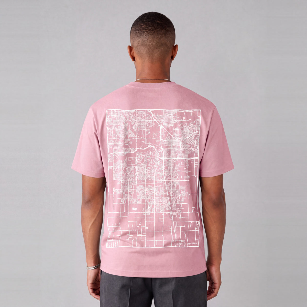 Bakersfield map tee, back print on model - Pink