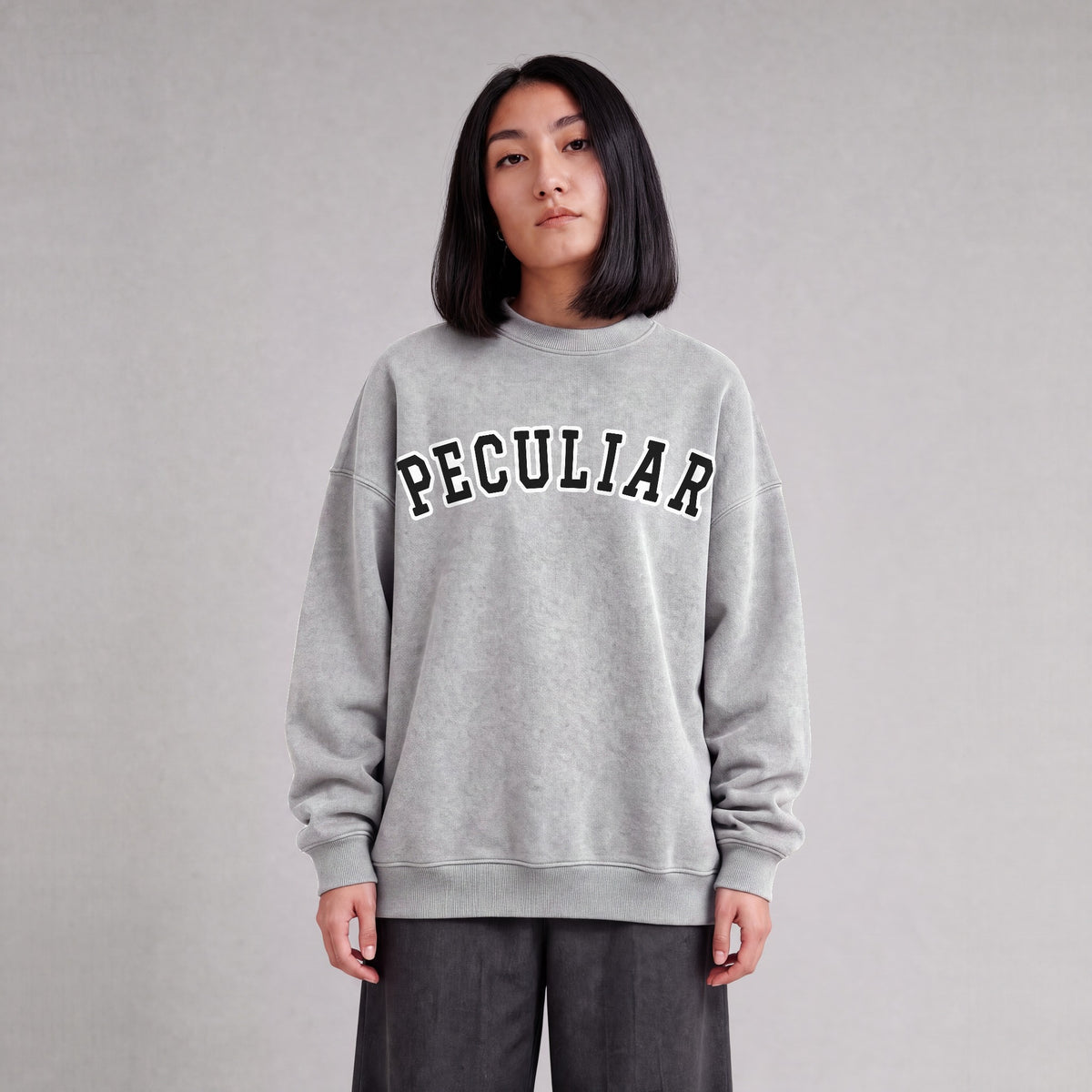 "Peculiar" collegiate sweatshirt front print on model - Heather Gray