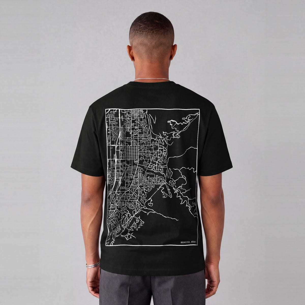 Bountiful map tee, back print on model - Black