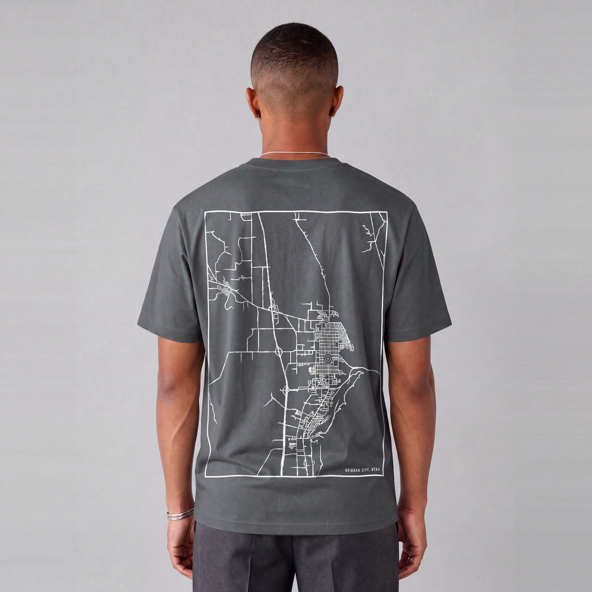 Brigham City map tee, back print on model - Charcoal