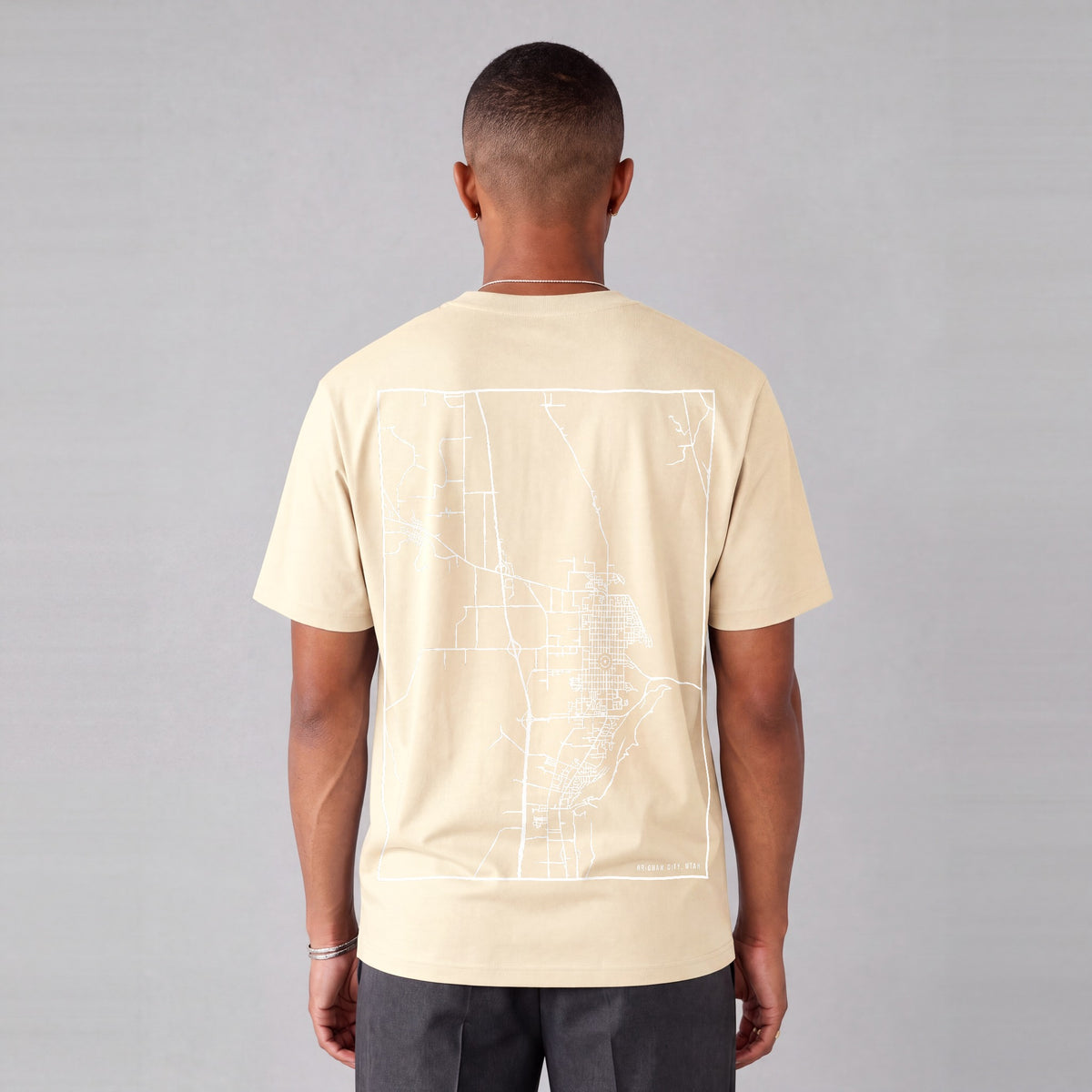 Brigham City map tee, back print on model - Cream