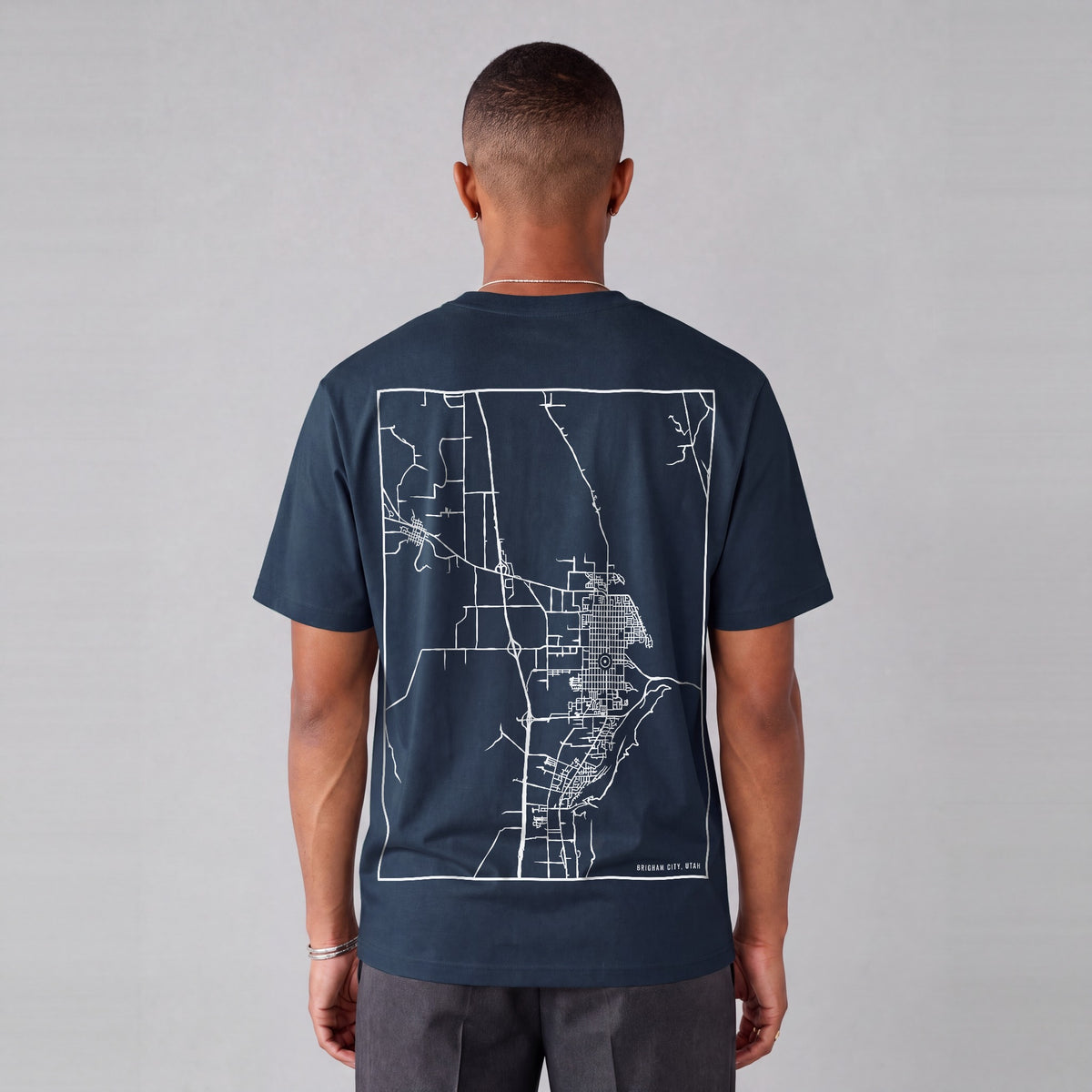 Brigham City map tee, back print on model - Navy Blue