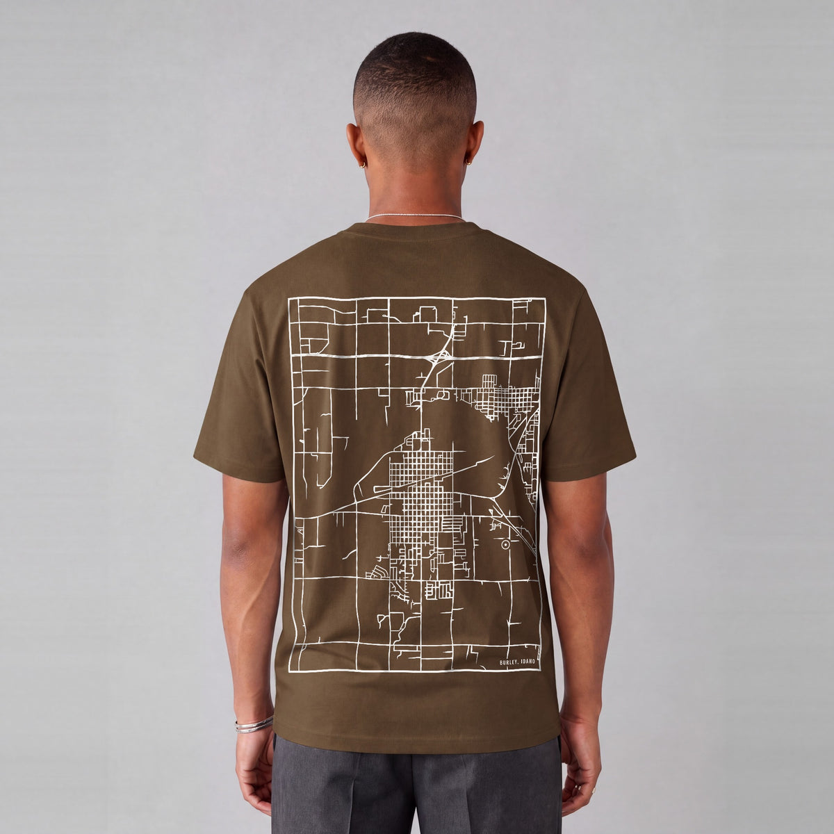 Burley map tee, back print on model - Coffee