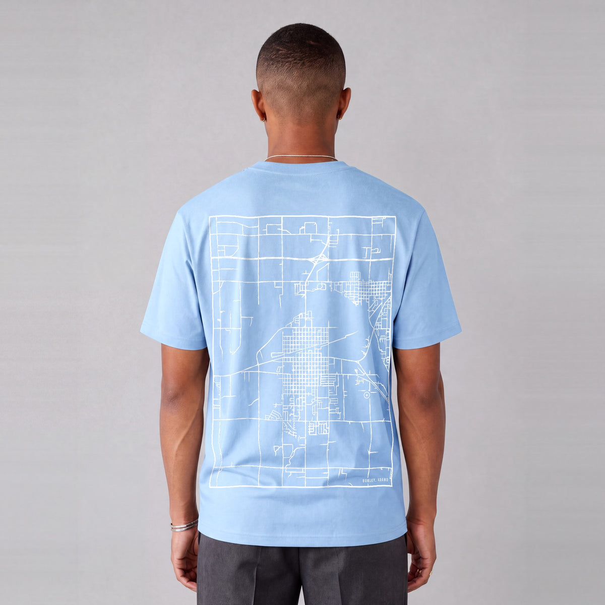 Burley map tee, back print on model - Light Blue