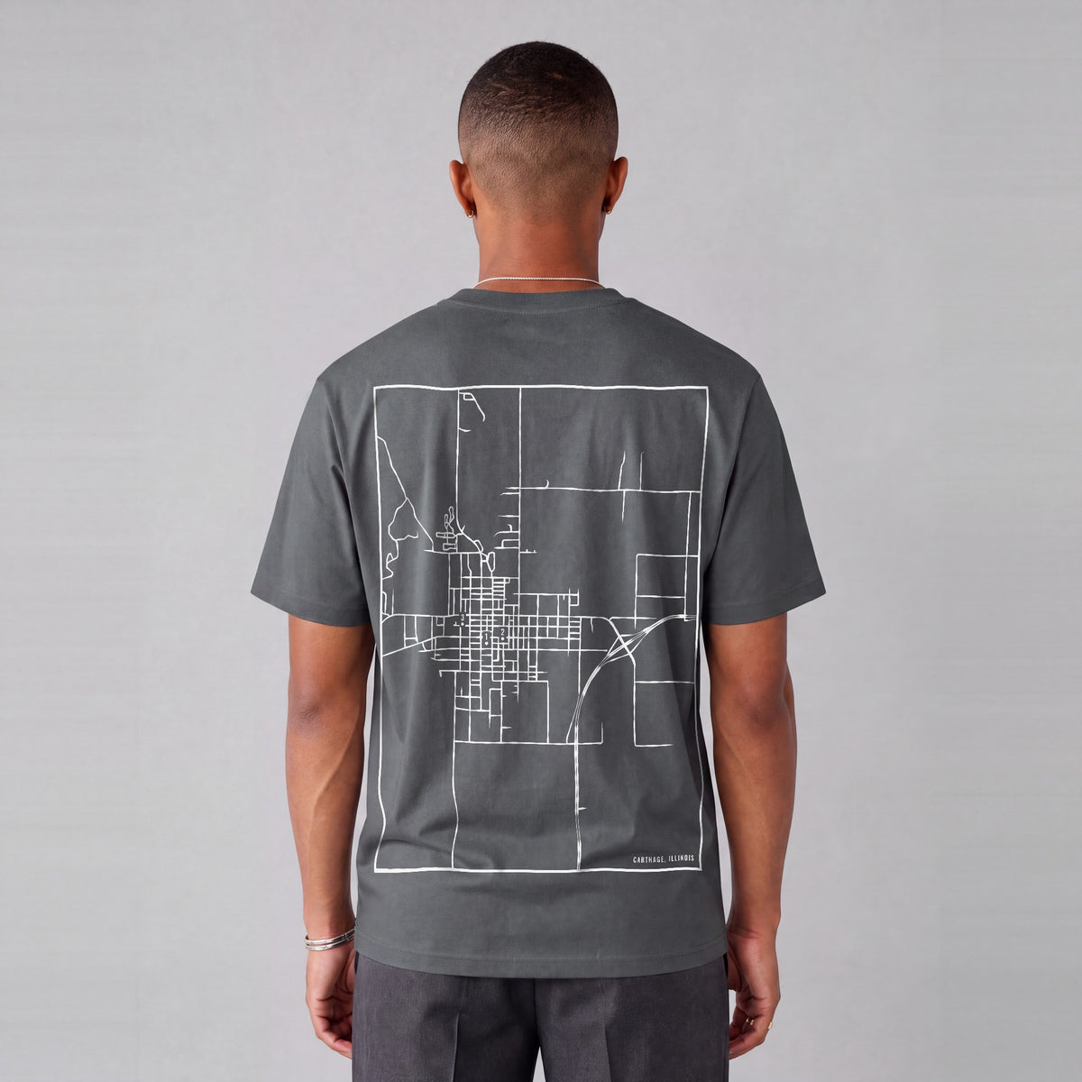 Carthage map tee, back print on model - Charcoal