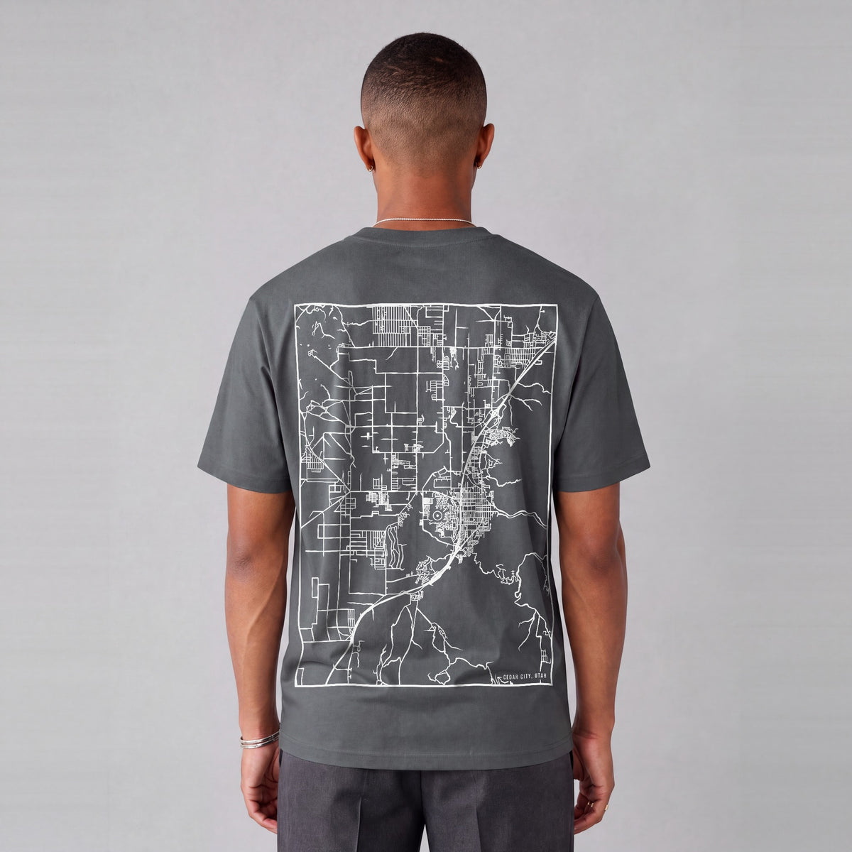 Cedar City map tee, back print on model - Charcoal