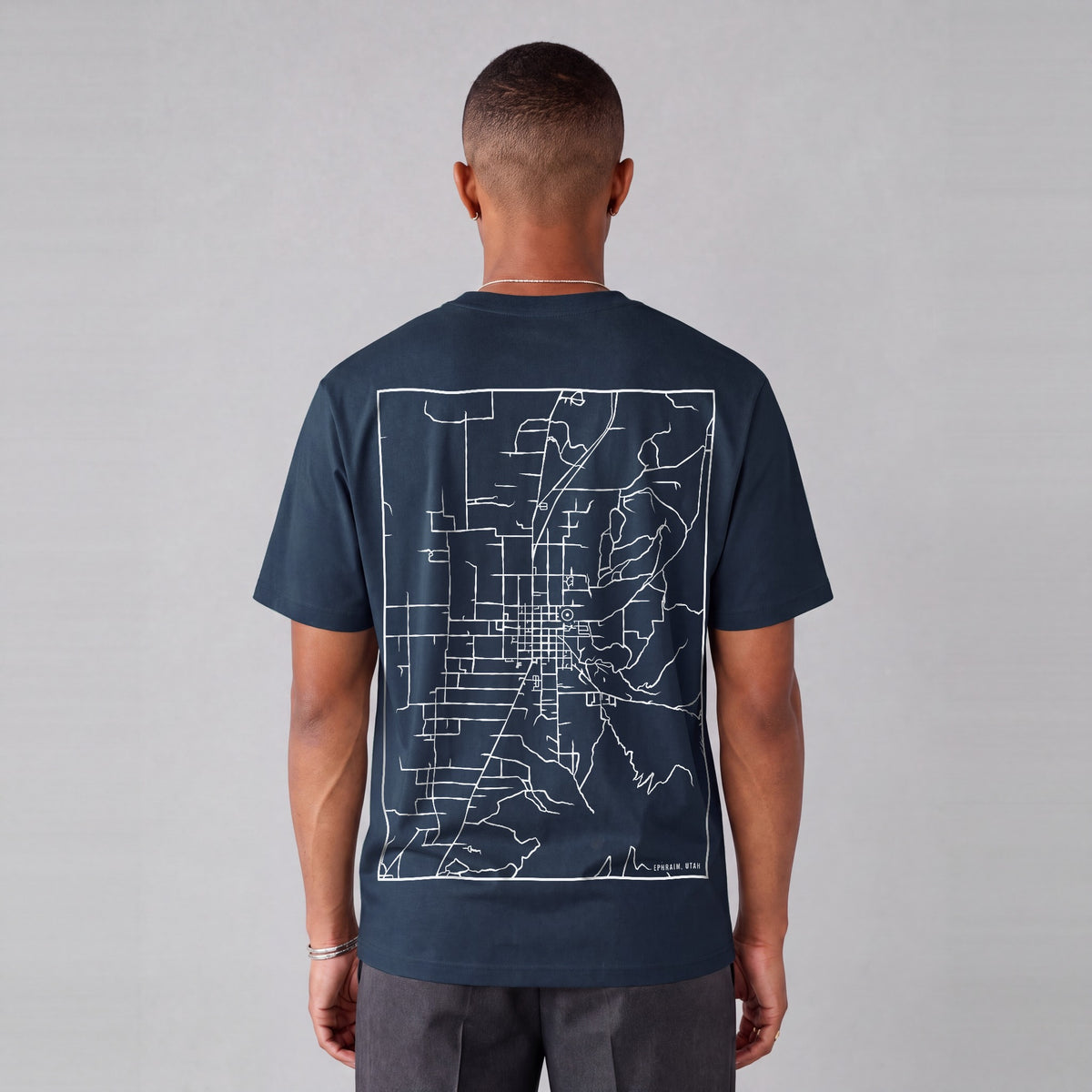 Ephraim map tee, back print on model - Navy Blue