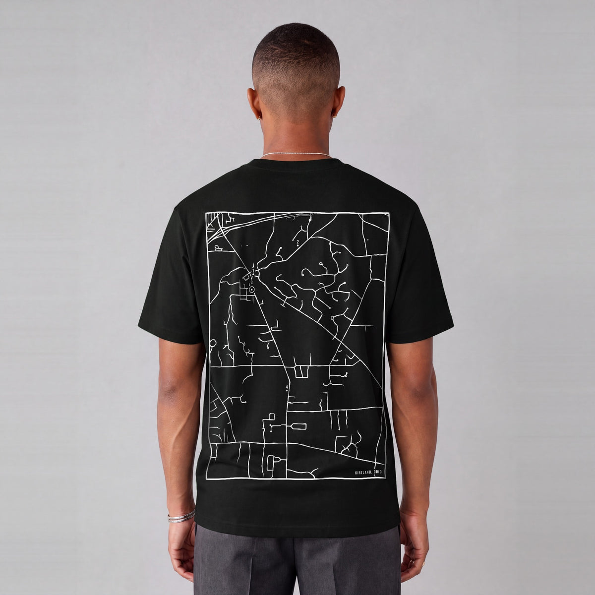 Kirtland map tee, back print on model - Black