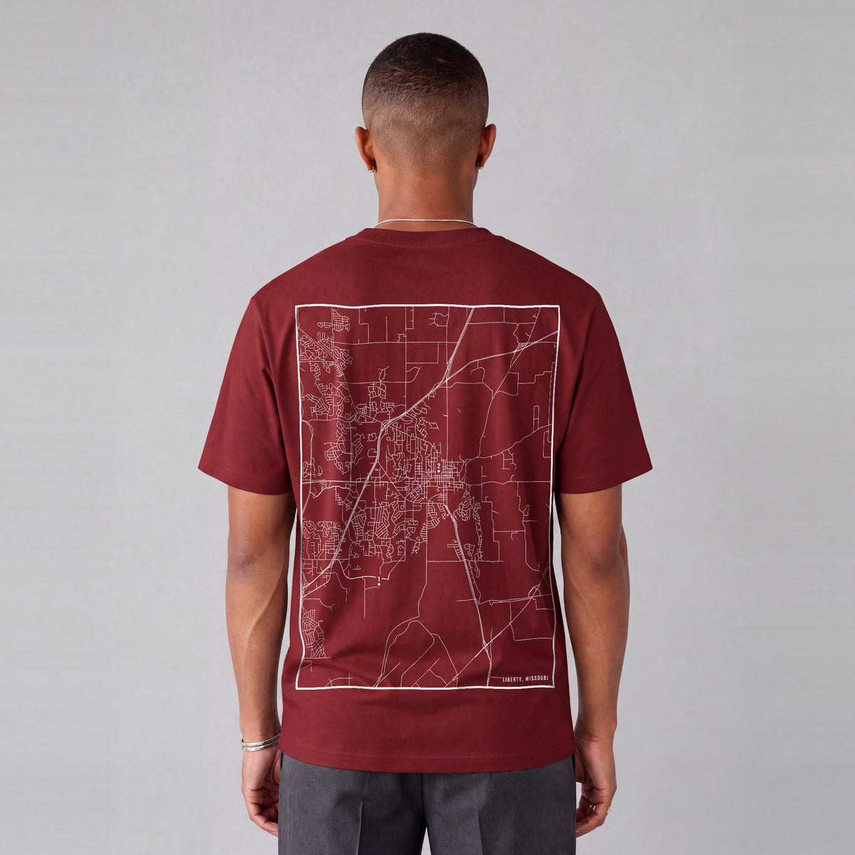 Liberty map tee, back print on model - Maroon