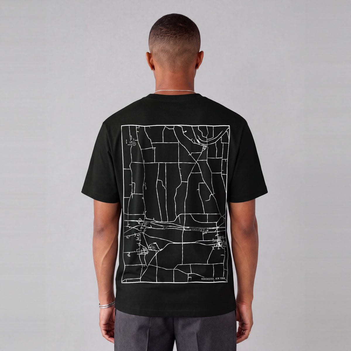 Manchester map tee, back print on model - Black