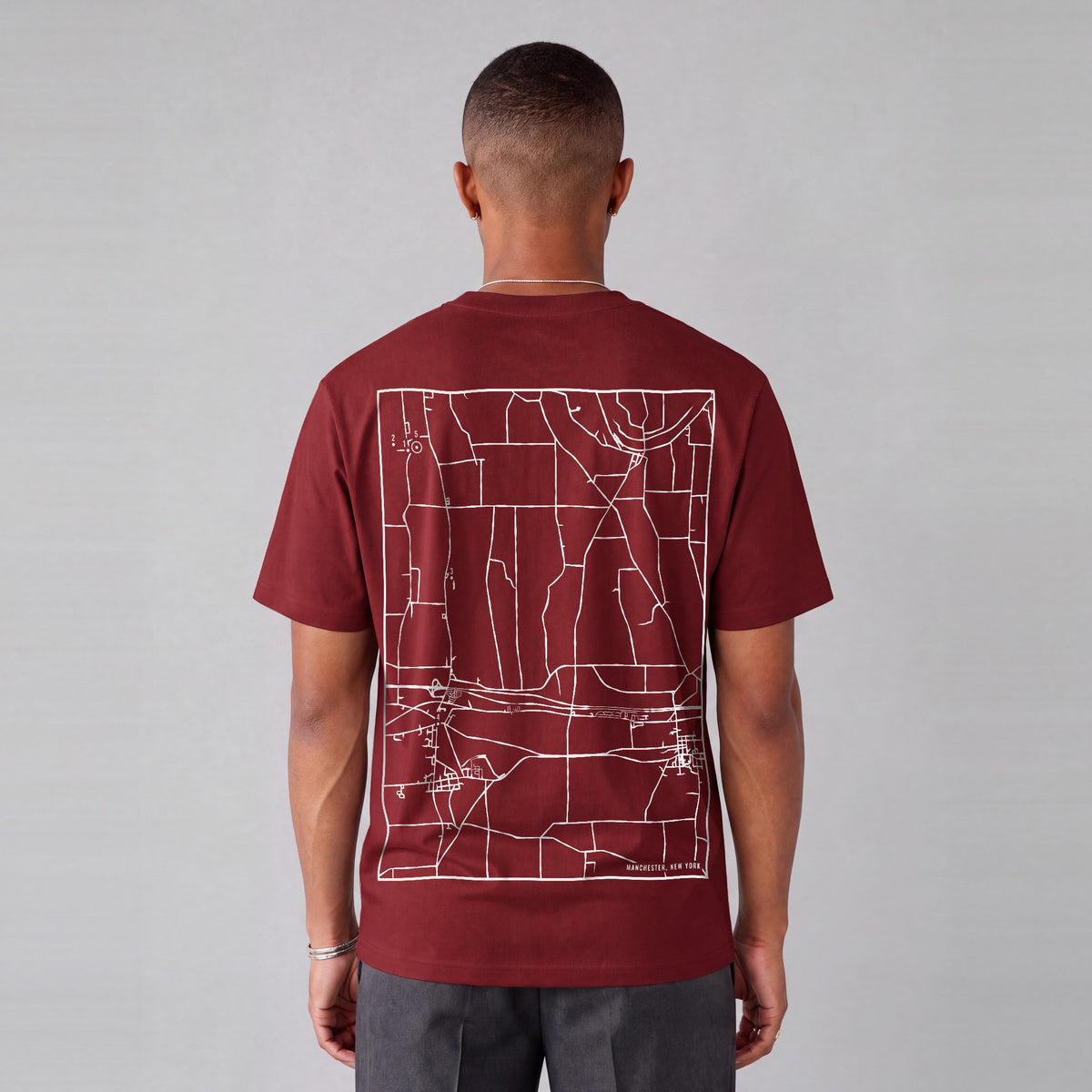 Manchester map tee, back print on model - Maroon