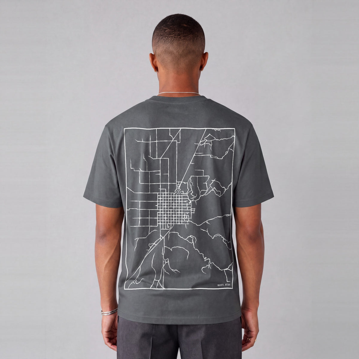 Manti map tee, back print on model - Charcoal