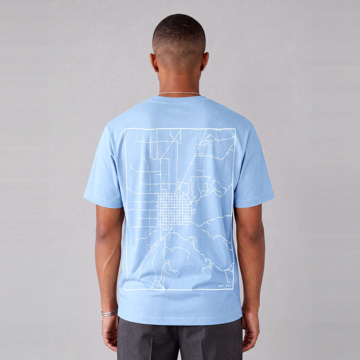 Manti map tee, back print on model - Light Blue
