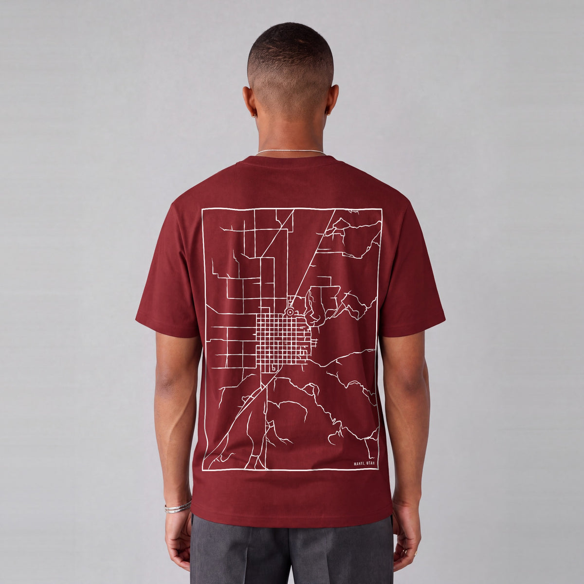 Manti map tee, back print on model - Maroon