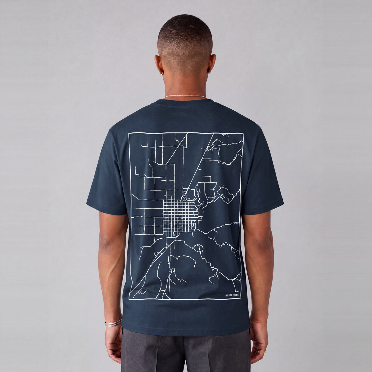 Manti map tee, back print on model - Navy Blue