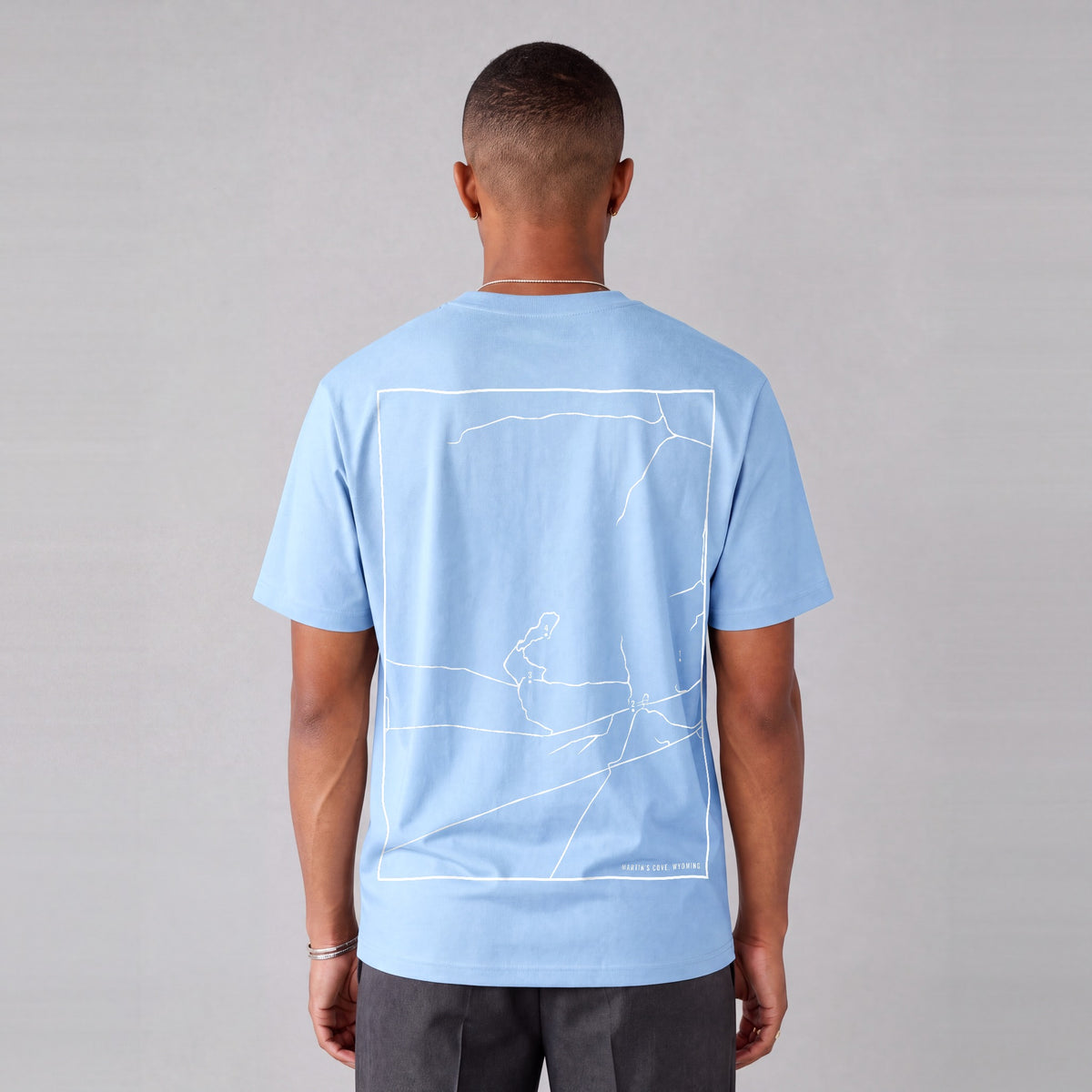 Martin's Cove map tee, back print on model - Light Blue