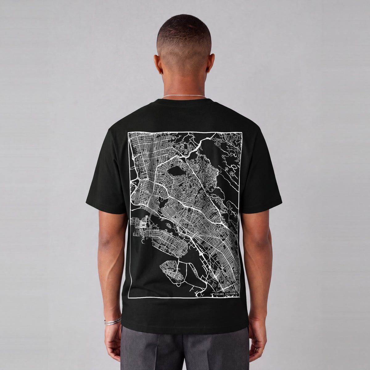 Oakland map tee, back print on model - Black