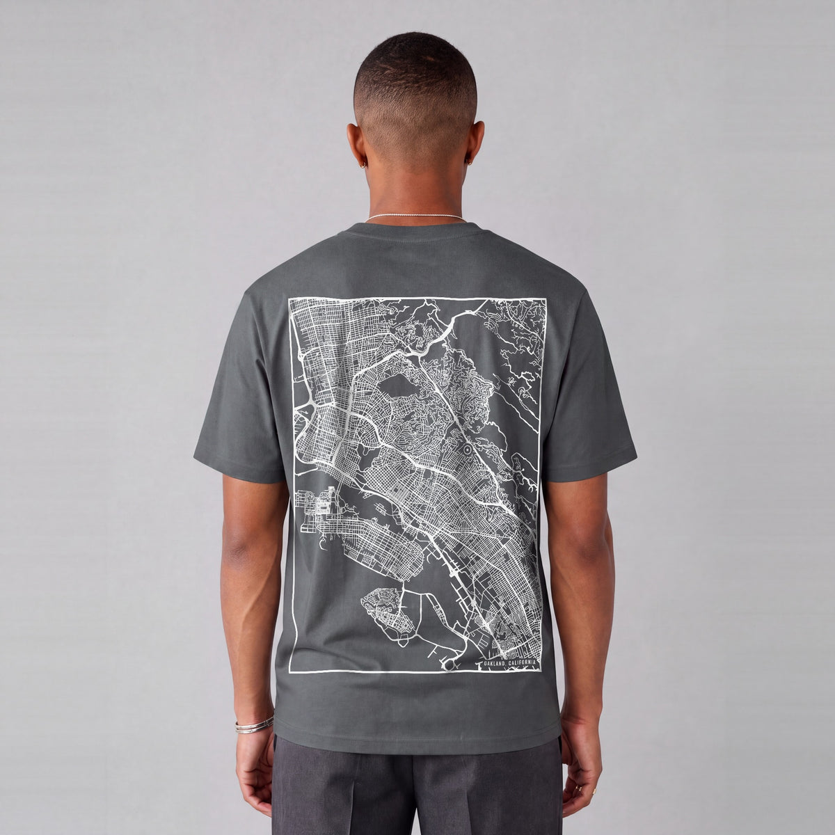 Oakland map tee, back print on model - Charcoal