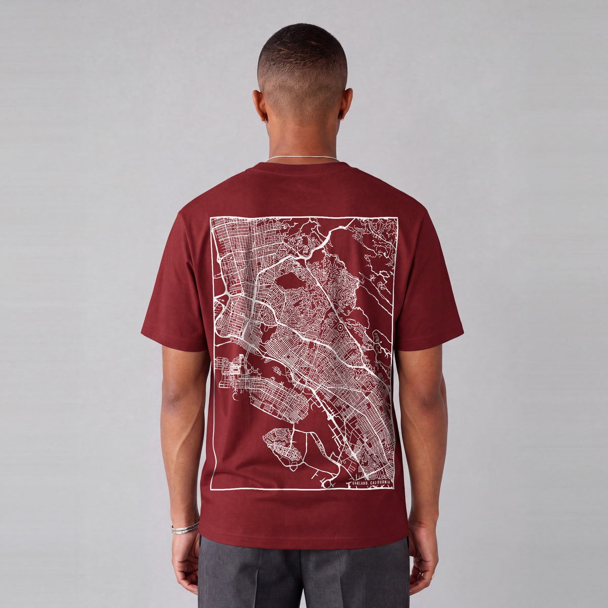 Oakland map tee, back print on model - Maroon