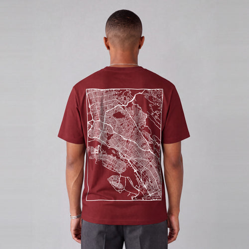 Oakland map tee, back print on model - Maroon