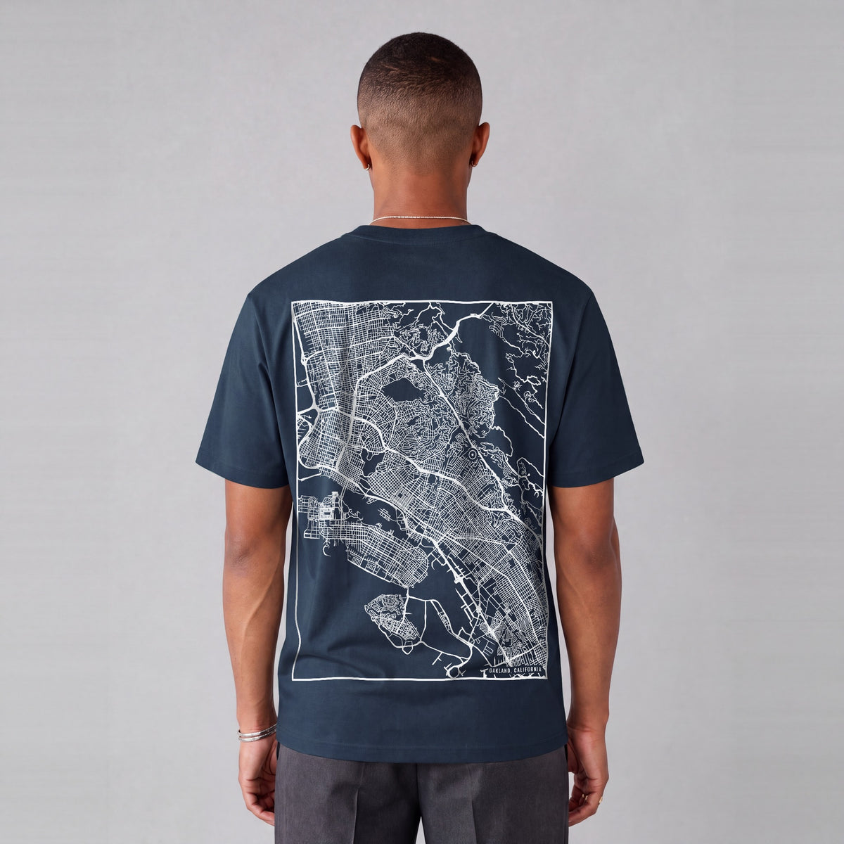 Oakland map tee, back print on model - Navy Blue