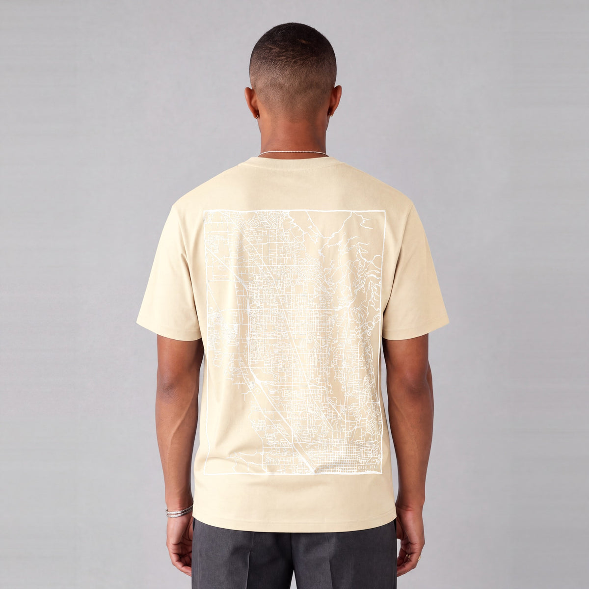 Orem map tee, back print on model - Cream
