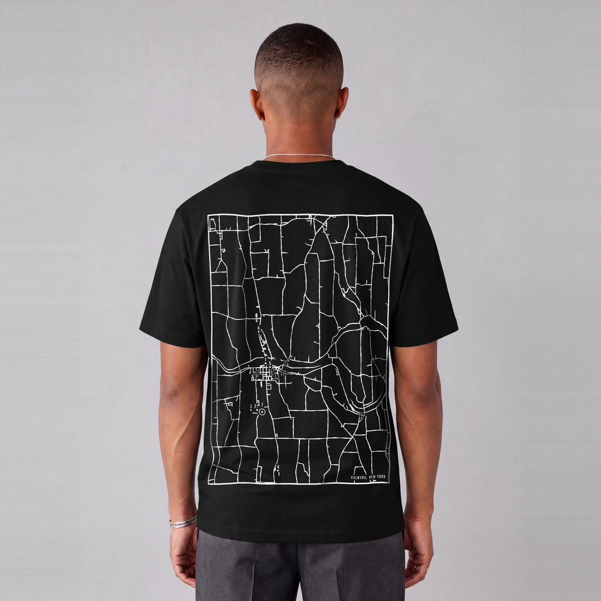 Palmyra map tee, back print on model - Black