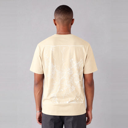 St. George map tee, back print on model - Cream