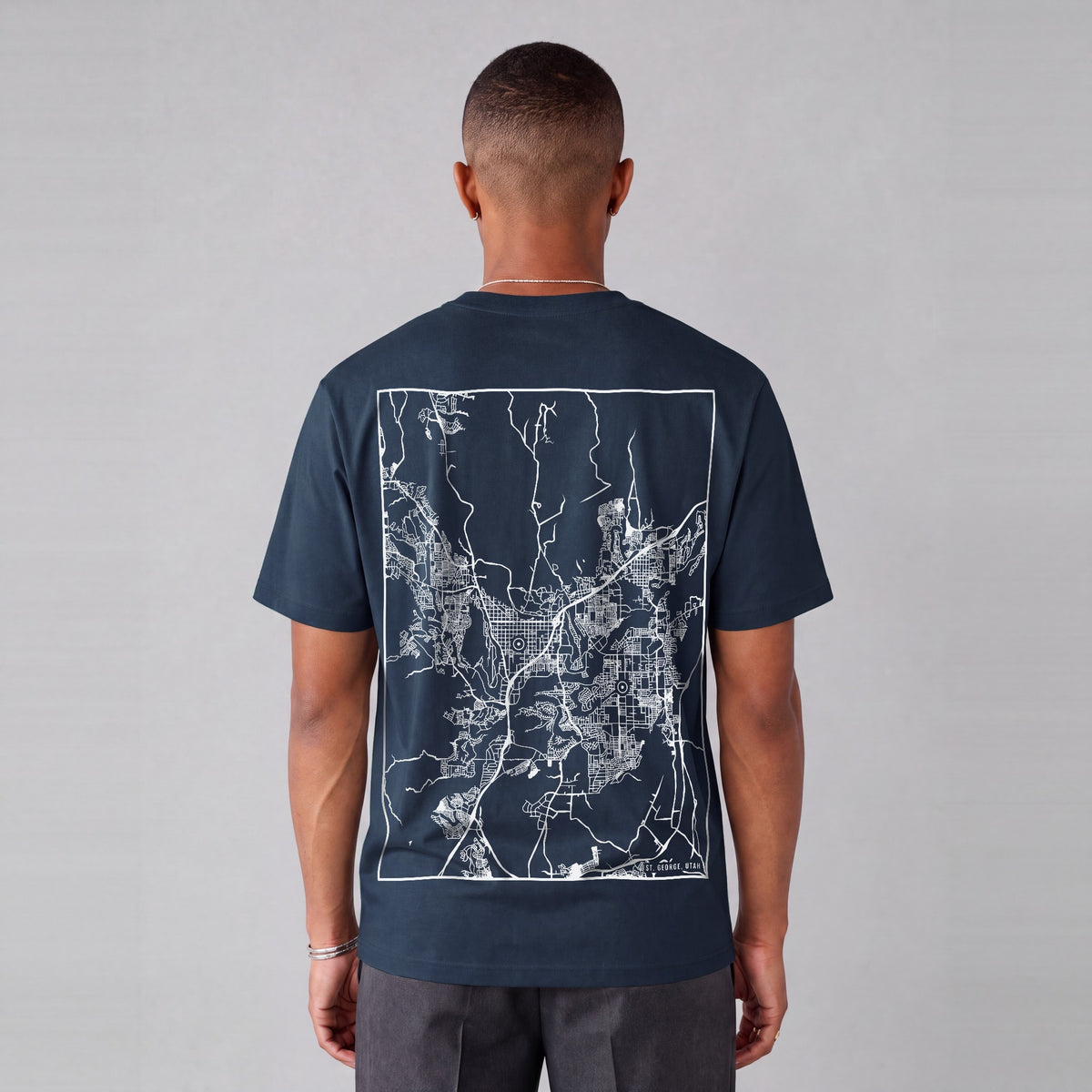 St. George map tee, back print on model - Navy Blue