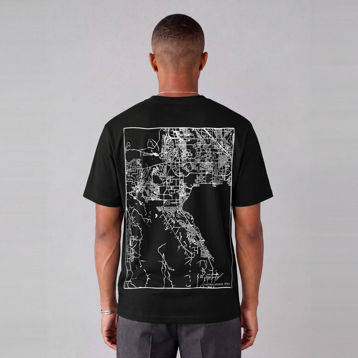 Saratoga Springs map tee, back print on model - Black