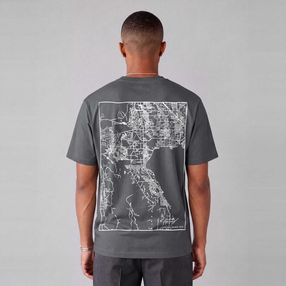 Saratoga Springs map tee, back print on model - Charcoal