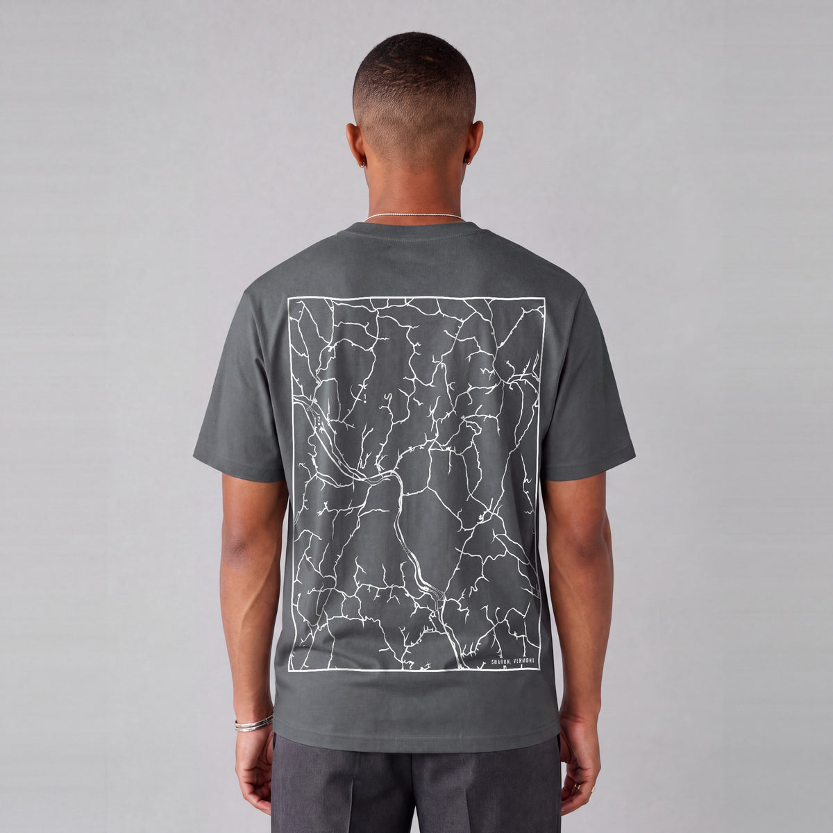 Sharon map tee, back print on model - Charcoal