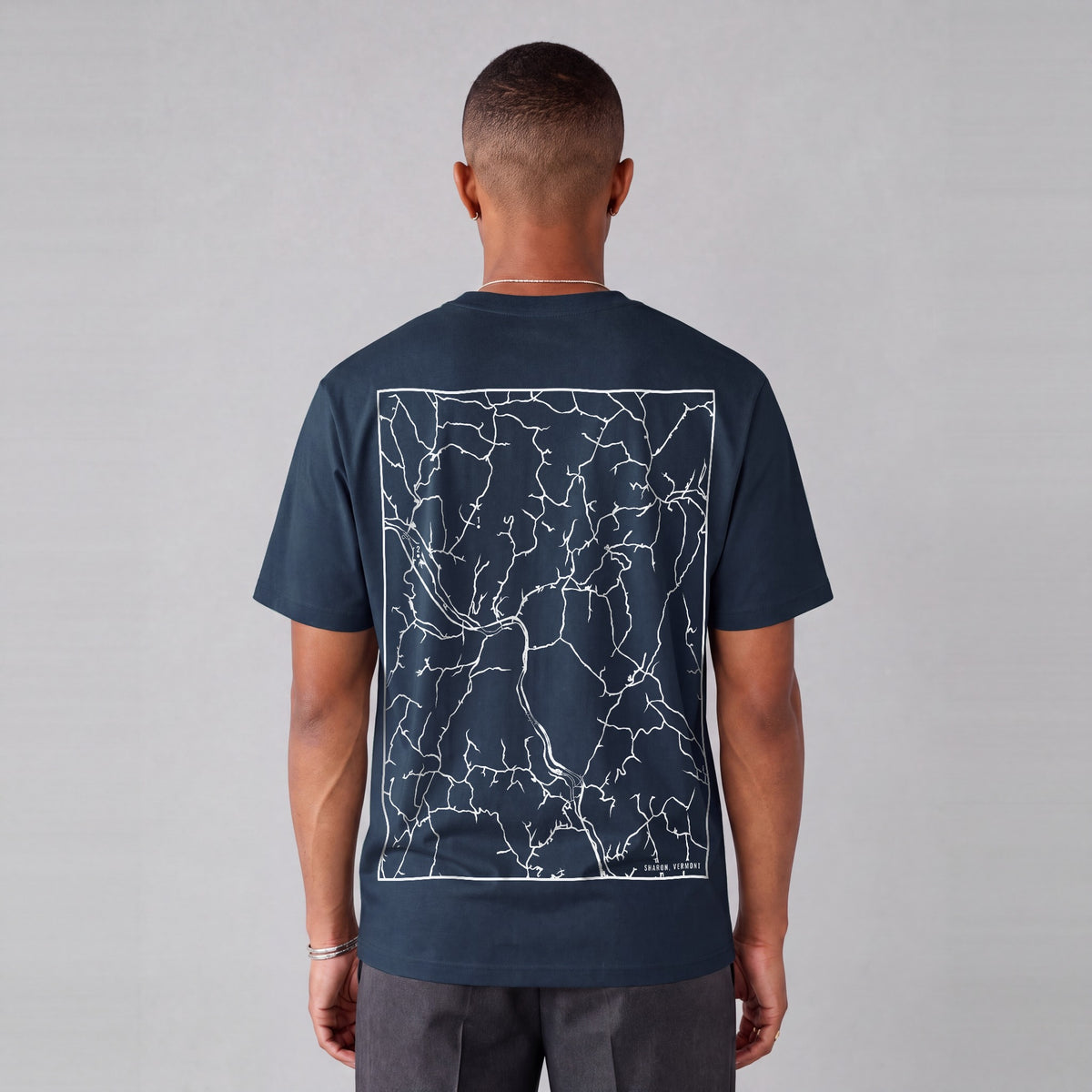 Sharon map tee, back print on model - Navy Blue