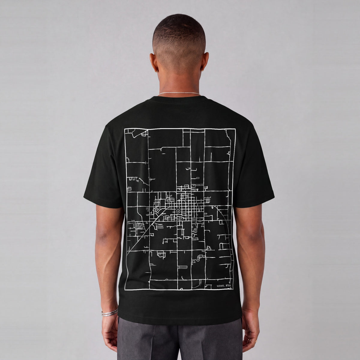 Vernal map tee, back print on model - Black